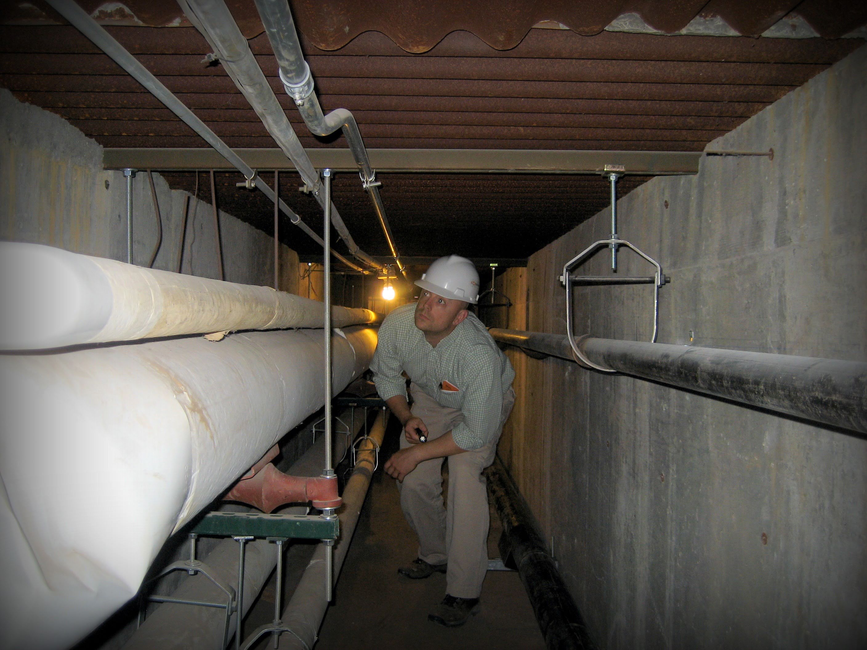 Engineer in Tunnel with Piping